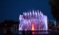 People wondering colourful fountain Royalty Free Stock Photo