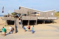 People walking wooden beach restaurant sea, Renesse, Zeeland, Netherlands