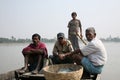 People in wooden boat crosses the Ganges River in Gosaba, West Bengal, India