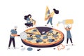 People work in a pizzeria. Workers in uniform. Women holding and eating pieces of big pizza