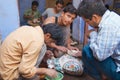 People work in a workshop creating traditional floral marble design, produced by muslim Bharai community in Agra, India.