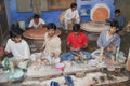 People work in a workshop creating traditional floral marble design, produced by muslim Bharai community in Agra, India.