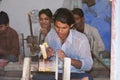 People work in a workshop creating traditional floral marble design, produced by muslim Bharai community in Agra, India.