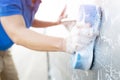 People worker man holding hand blue sponge and bubble foam cleanser for washing car. Royalty Free Stock Photo