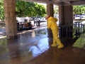 People Workers Man cleaning Sidewalk using Power Sprayer