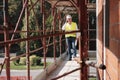 Engineer Talking On Mobile Phone In Construction Site