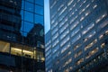 People working in open spaces offices in a skyscraper, seen from the outside, in the evening, in Montreal, Quebec