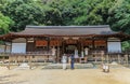 People worship at the Honden main hall of the Ujigami Shrine