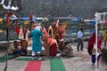 People are worship in the open temple of Manimahesh on Manimahesh yatra near the lake