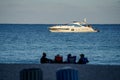 People on a yacht in the ocean shot with super telephoto lens