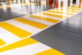 People at the zebra crossing underground Parking. Parking garage underground interior, pedestrian crossing, neon lights