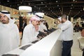 Peoples checking Pistols at Abu Dhabi International Hunting and Equestrian Exhibition