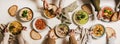 Peoples hands eating homemade soup with fresh bread