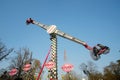 Peoples having fun with carousel rocket Amusement Park Ride at the Luna (MENEGHINO) Park in Milan - ITA -2023 March Royalty Free Stock Photo