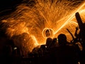 Peoples are looking at fire dancing (silhouette shot)