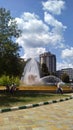 Peoples standing near artesian fountain in a summer day