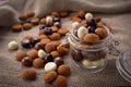 Pepernoten cookies in glass jar on sackcloth. Traditional sweets for St. Nicholas Day
