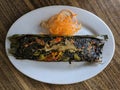 Pepes ikan bandeng is Indonesian traditional food, steam milkfish wrapped with banana leaf