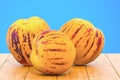 Pepinos or sweet cucumbers close-up 3d rendering with realistic texture on the wooden table