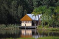 Pepper Creek, Australia - Apr 2013: Timber lakehouse surrounded by lush forest and greenery at scenic winery in the Hunter Valley Royalty Free Stock Photo