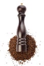 pepper mill on peppercorns heap on white