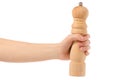 Pepper mill wooden in hand Royalty Free Stock Photo