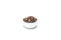Pepper mix in bowl isolated on white background, top view. Royalty Free Stock Photo