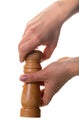 Pepper shaker in hands Royalty Free Stock Photo