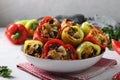 Pepper stuffed with eggplant, onions and carrots on light gray background, Vegetarian food