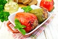 Pepper stuffed meat in brown roaster with basil Royalty Free Stock Photo