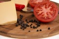 Pepper tomato and cheese on the kitchen board. Royalty Free Stock Photo