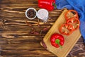 Pepper, tomato, salt, different spice on wooden background Royalty Free Stock Photo