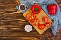 Pepper, tomato, salt, different spice on wooden background Royalty Free Stock Photo