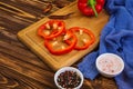 Pepper, tomato, salt, different spice on wooden background Royalty Free Stock Photo
