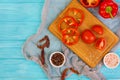 Pepper, tomato, salt, different spice on wooden background Royalty Free Stock Photo