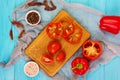 Pepper, tomato, salt, different spice on wooden background Royalty Free Stock Photo