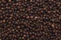 Peppercorn background. Dry black pepper seeds. Top view. Flat design. Macro spice background