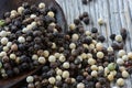 Peppercorns on rustic wooden table