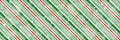 Peppermint candy cane Christmas background with diagonal stripes and shiny snowflakes print seamless pattern Royalty Free Stock Photo