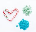 Peppermint candy cane, Christmas tree green sugar sprinkles, blue snowflake sugar sprinkles for decoration festive sweet food Royalty Free Stock Photo