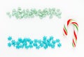 Peppermint candy cane, Christmas tree green sugar sprinkles, blue snowflake sugar sprinkles Royalty Free Stock Photo