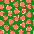 Peppermint candy finish guitar pick seamless pattern on green background. Concept for Christmas holiday wrapping paper Royalty Free Stock Photo