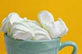 Peppermint large marshmallows in a big green cup Royalty Free Stock Photo