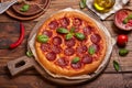 Pepperoni pizza. American style homemade pizza with salami, mozzarella cheese and tomato sauce.