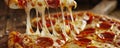 Pepperoni pizza with melted cheese being pulled with a slice Royalty Free Stock Photo