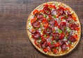 Pepperoni Pizza with Mozzarella cheese, salami, Tomato sauce, pepper, onion, Spices. Italian pizza on wooden table Royalty Free Stock Photo