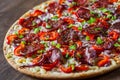 Pepperoni Pizza with Mozzarella cheese, salami, Tomato sauce, pepper, onion, Spices. Italian pizza on wooden table Royalty Free Stock Photo