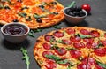 Pepperoni Pizza and Pizza with Mozzarella cheese, Tomatoes, pepper, olive, Spices and Fresh arugula. Pizza Margherita or Margarita Royalty Free Stock Photo