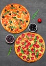 Pepperoni Pizza and Pizza with Mozzarella cheese, Tomatoes, pepper, olive, Spices and Fresh arugula. Pizza Margherita or Margarita Royalty Free Stock Photo