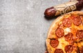 Pepperoni pizza with salami and cheese. On stone table. Royalty Free Stock Photo